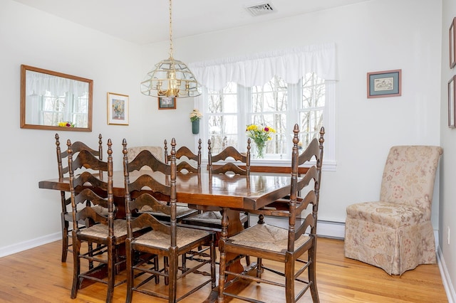 125 Tick Tock Way, Stanfordville, NY 12581 - dining room with a chandelier, light wood-style floors, baseboards, and baseboard heating
