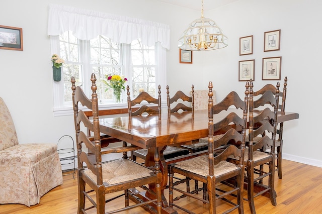 125 Tick Tock Way, Stanfordville, NY 12581 - dining room featuring a chandelier, light wood-type flooring, and baseboards