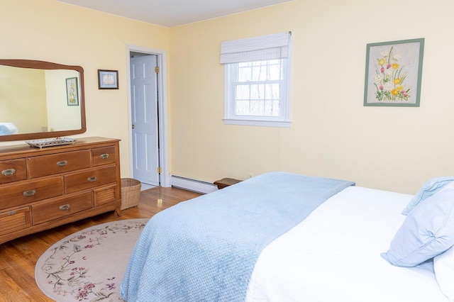 125 Tick Tock Way, Stanfordville, NY 12581 - bedroom with a baseboard heating unit and wood finished floors