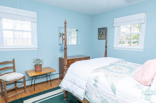 125 Tick Tock Way, Stanfordville, NY 12581 - bedroom with baseboard heating and wood finished floors