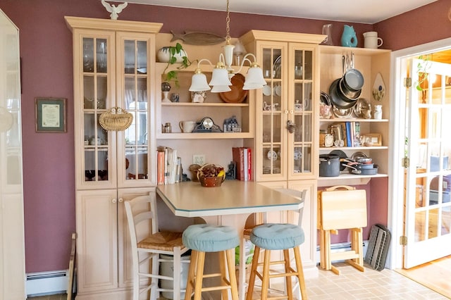 125 Tick Tock Way, Stanfordville, NY 12581 - dining room with brick patterned floors and a baseboard heating unit