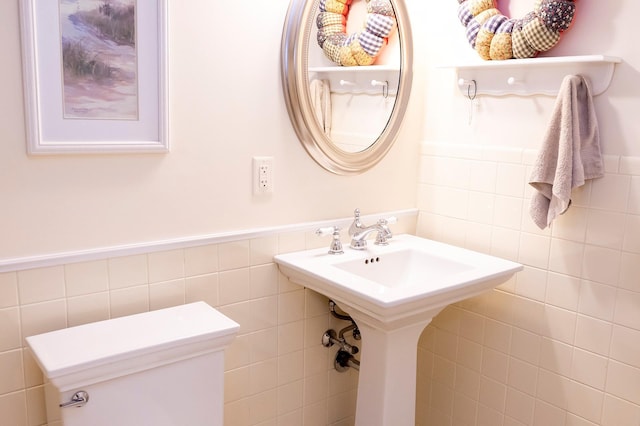 125 Tick Tock Way, Stanfordville, NY 12581 - half bathroom with tile walls, a wainscoted wall, and toilet