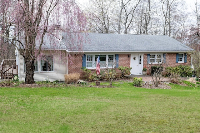 125 Tick Tock Way, Stanfordville, NY 12581 - ranch-style home featuring brick siding, a chimney, a front lawn, and roof with shingles