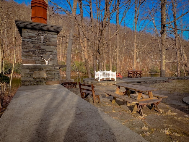 view of home's community with a patio area