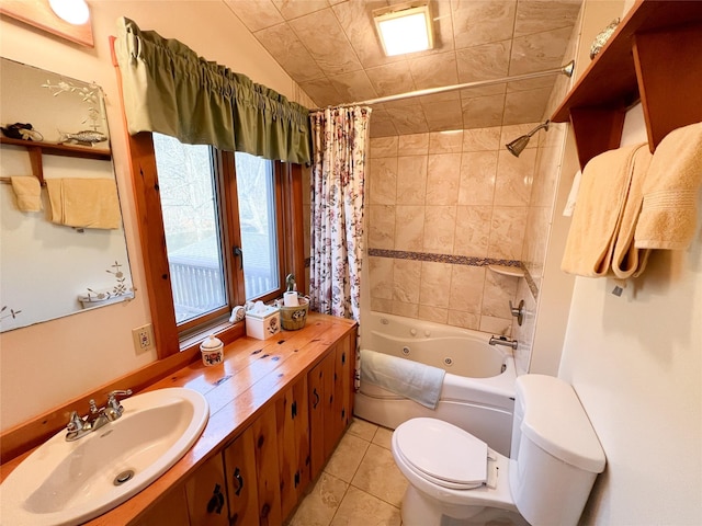 full bath featuring tile patterned floors, a combined bath / shower with jetted tub, vanity, and toilet