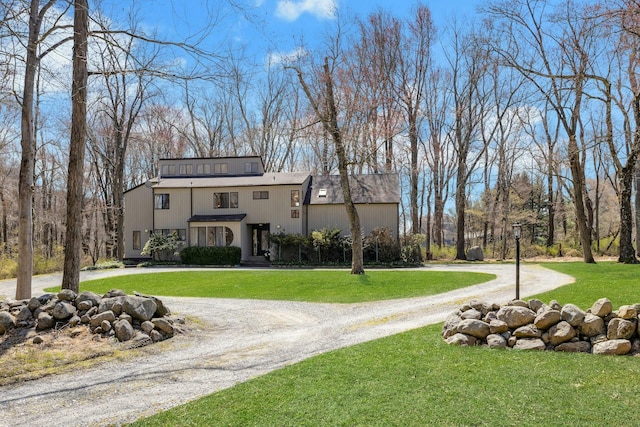 20 Schoolhouse Rd, Waccabuc, NY 10597 - view of front of home featuring a front lawn and curved driveway