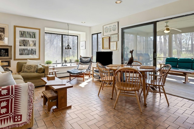 20 Schoolhouse Rd, Waccabuc, NY 10597 - dining space featuring a baseboard heating unit, a ceiling fan, and recessed lighting