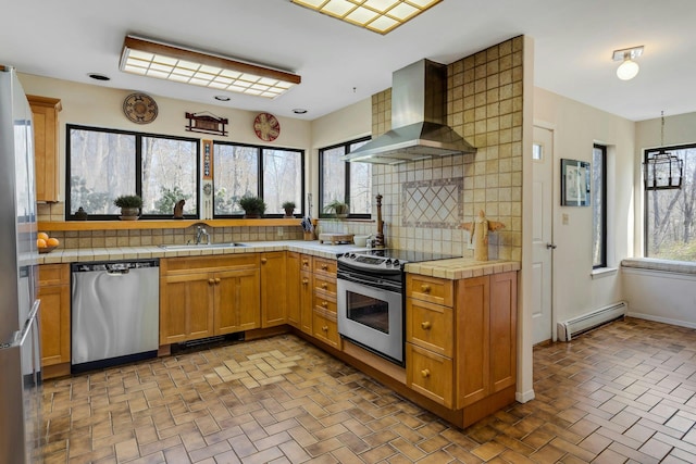 20 Schoolhouse Rd, Waccabuc, NY 10597 - kitchen featuring a sink, a baseboard heating unit, tile countertops, wall chimney exhaust hood, and appliances with stainless steel finishes