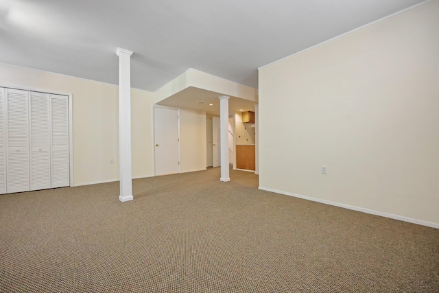 finished below grade area featuring baseboards and carpet