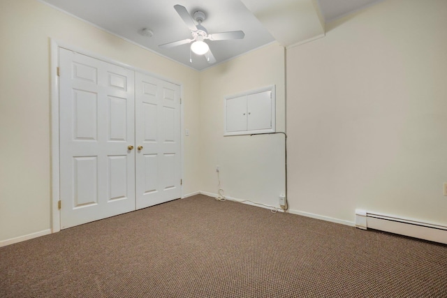 unfurnished bedroom featuring carpet floors, baseboards, a baseboard heating unit, and ceiling fan