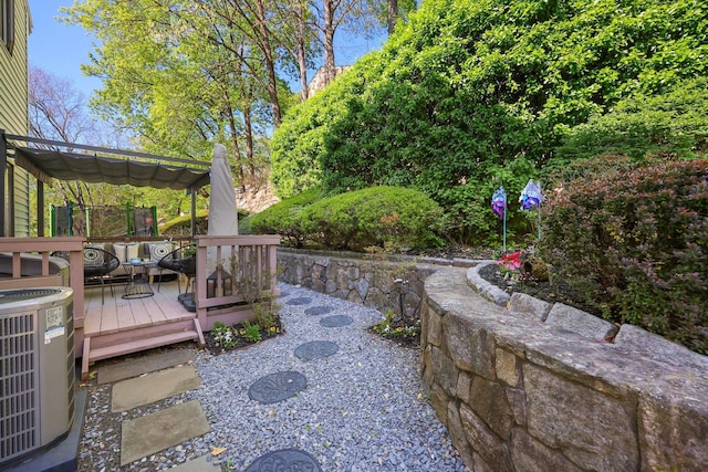 81 Pemberwick Rd Unit A, Greenwich, CT 06831 - view of yard with central AC and a wooden deck