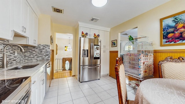 754 Wolcott Ave, Beacon, NY 12508 - kitchen with wainscoting, stainless steel appliances, visible vents, and a sink