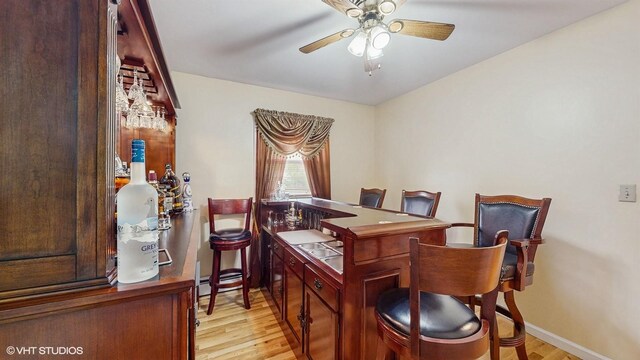 754 Wolcott Ave, Beacon, NY 12508 - dining room featuring light wood-style flooring, baseboards, and ceiling fan