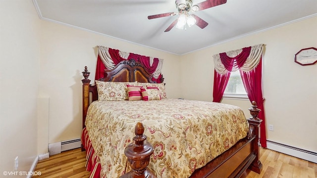 754 Wolcott Ave, Beacon, NY 12508 - bedroom with baseboard heating, light wood-style floors, and ornamental molding