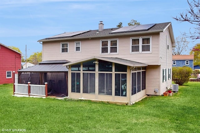754 Wolcott Ave, Beacon, NY 12508 - back of property with a gazebo, a chimney, a yard, solar panels, and a sunroom