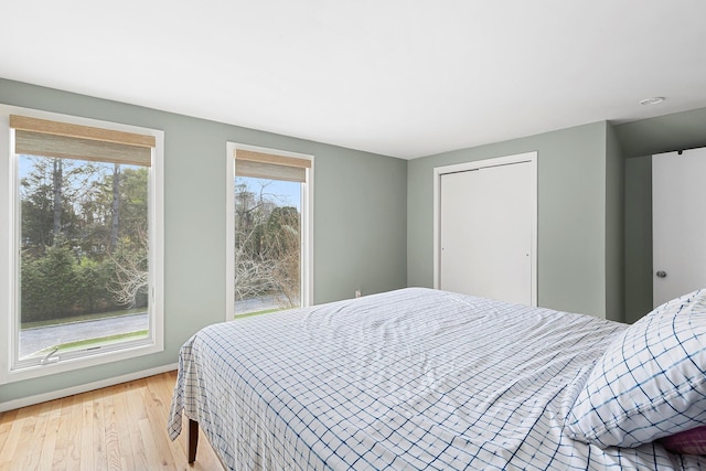 bedroom featuring light wood-style flooring