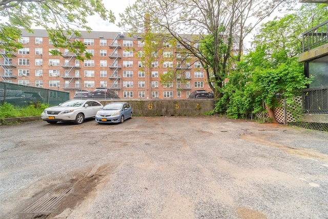 140-44 34th Ave Unit 4C, Flushing, NY 11354 - uncovered parking lot featuring fence