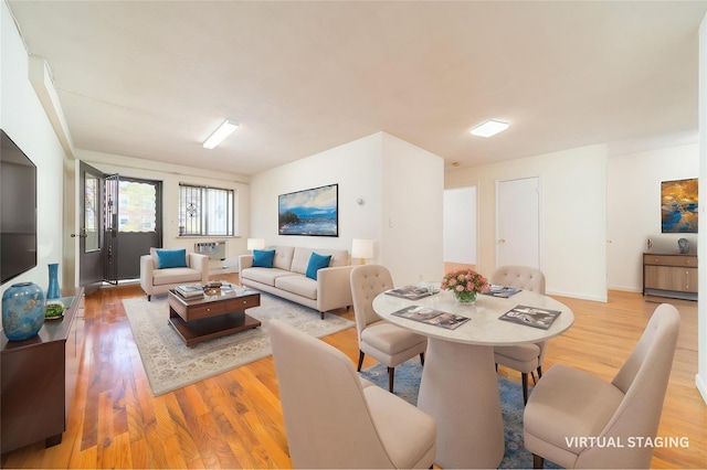140-44 34th Ave Unit 4C, Flushing, NY 11354 - living room featuring wood finished floors and baseboards
