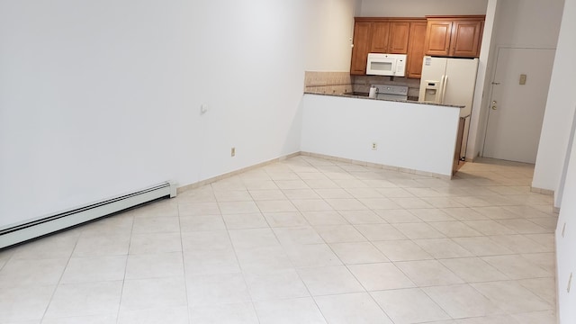 interior space featuring light tile patterned floors and baseboard heating