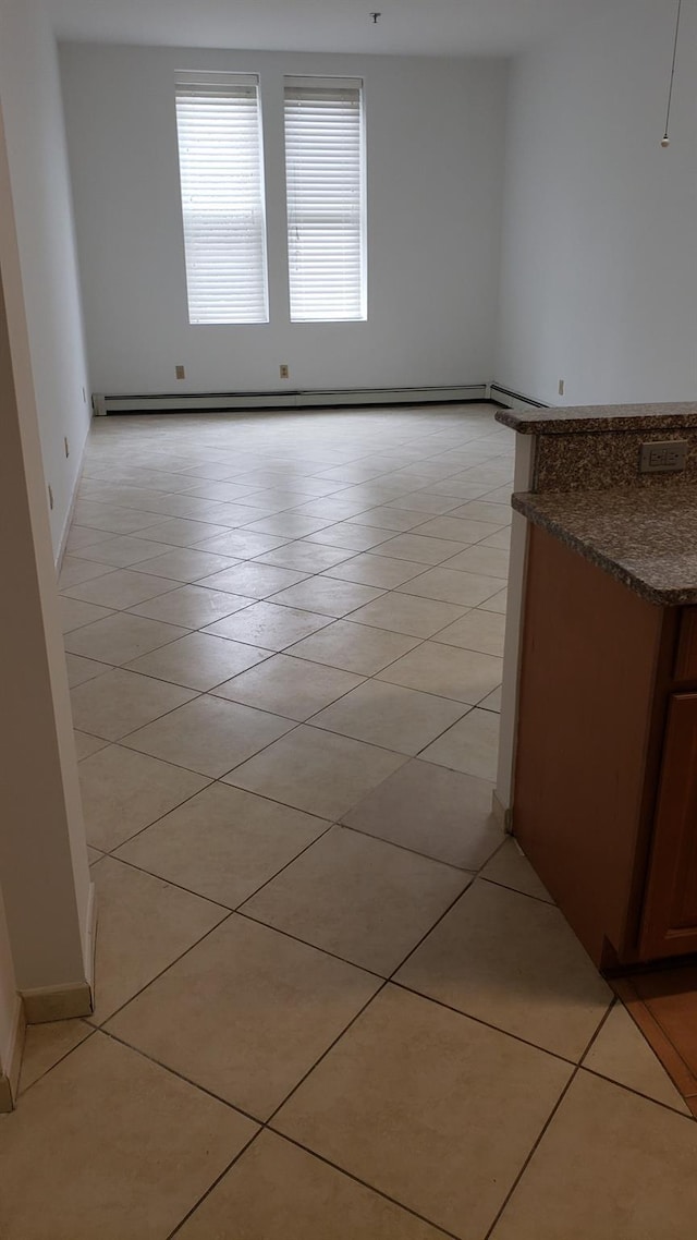 empty room with light tile patterned floors