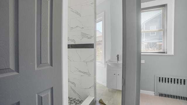 9920 196th St, Hollis, NY 11423 - full bath featuring a marble finish shower, radiator heating unit, and plenty of natural light