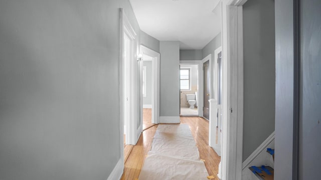 9920 196th St, Hollis, NY 11423 - corridor with baseboards and light wood-style flooring