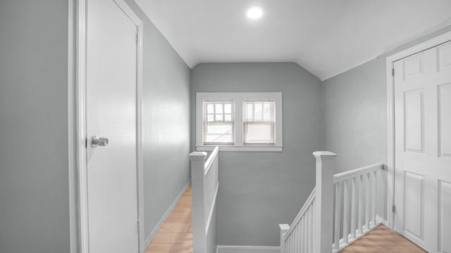 9920 196th St, Hollis, NY 11423 - staircase with baseboards, wood finished floors, and vaulted ceiling