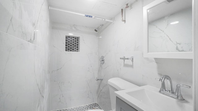 9920 196th St, Hollis, NY 11423 - bathroom featuring tile walls, toilet, a shower, and vanity