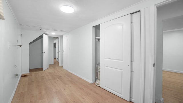 9920 196th St, Hollis, NY 11423 - hallway featuring light wood-style flooring and baseboards