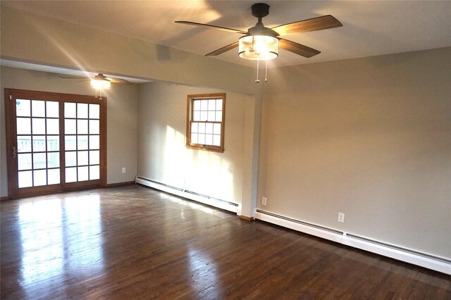 empty room with a baseboard heating unit, ceiling fan, and dark wood-style flooring