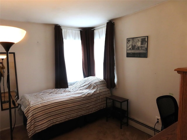 565 18th St, West Babylon, NY 11704 - carpeted bedroom with baseboards and a baseboard radiator