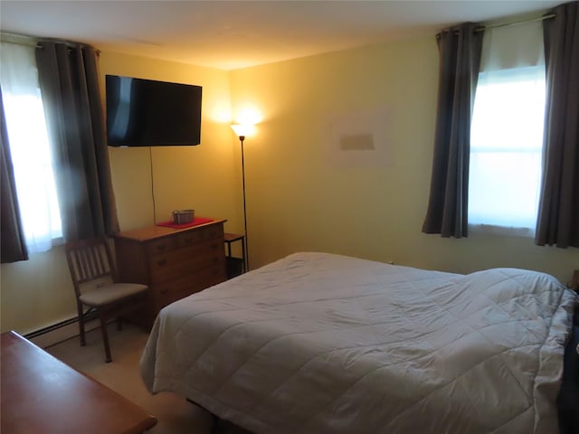 565 18th St, West Babylon, NY 11704 - bedroom with a baseboard radiator