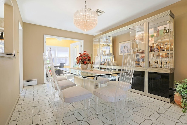 dining space with visible vents, a baseboard radiator, a chandelier, and a wealth of natural light
