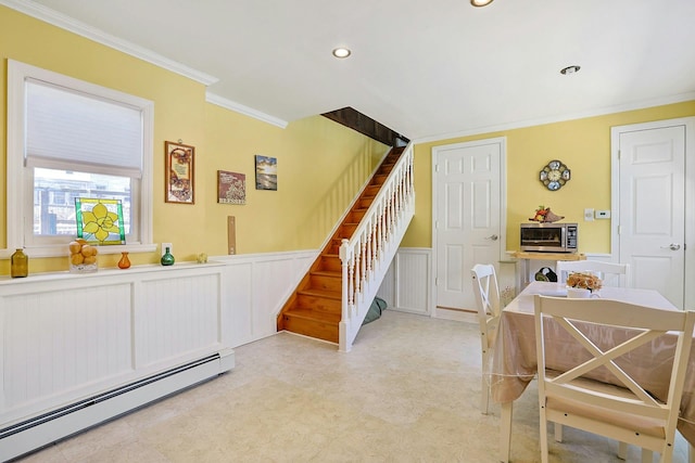 interior space featuring ornamental molding, stairway, recessed lighting, a baseboard heating unit, and a wainscoted wall