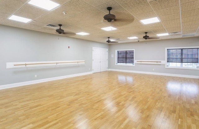 spare room with a paneled ceiling and a ceiling fan