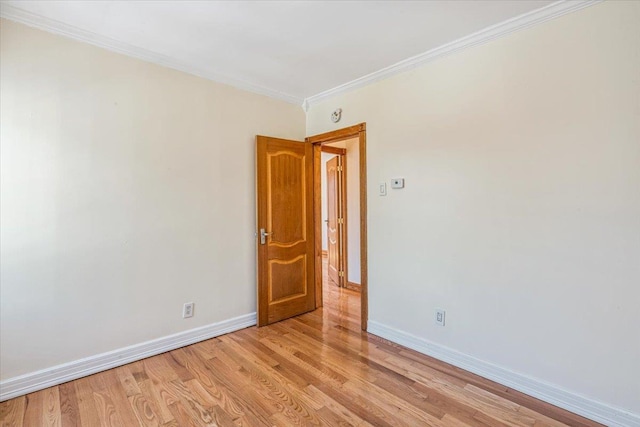 21-09 48th St, Astoria, NY 11105 - empty room featuring baseboards, light wood finished floors, and crown molding