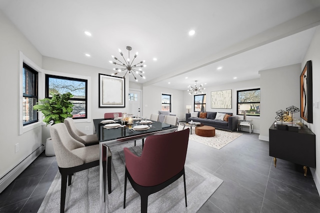 dining space featuring baseboard heating, baseboards, recessed lighting, and a chandelier