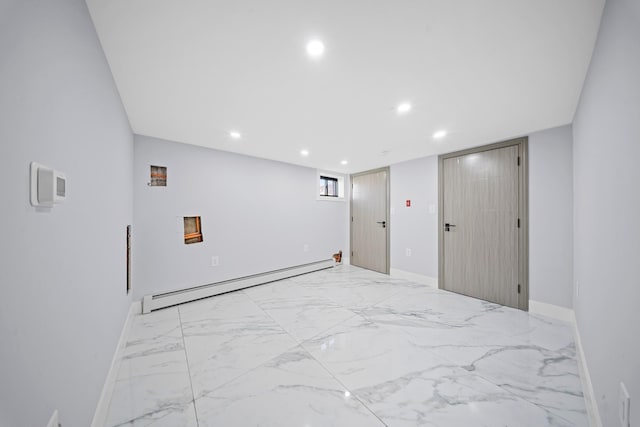 spare room with baseboards, marble finish floor, recessed lighting, and a baseboard radiator
