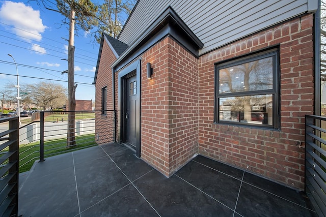 exterior space with brick siding