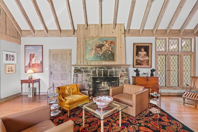 1391 Hunterbrook Rd, Yorktown Heights, NY 10598 - living area featuring high vaulted ceiling, wood finished floors, beam ceiling, a stone fireplace, and baseboards