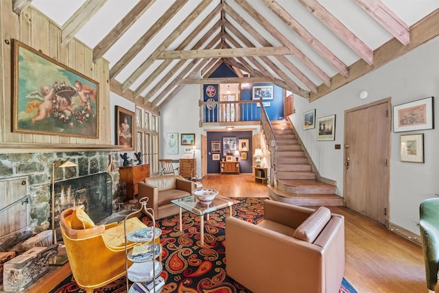 1391 Hunterbrook Rd, Yorktown Heights, NY 10598 - living area featuring wood finished floors, high vaulted ceiling, a premium fireplace, stairway, and beamed ceiling