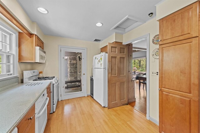 1391 Hunterbrook Rd, Yorktown Heights, NY 10598 - kitchen with white appliances, light wood-style flooring, recessed lighting, and brown cabinetry