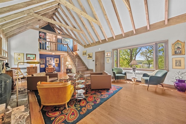1391 Hunterbrook Rd, Yorktown Heights, NY 10598 - living area with high vaulted ceiling, wood finished floors, stairs, beam ceiling, and baseboards