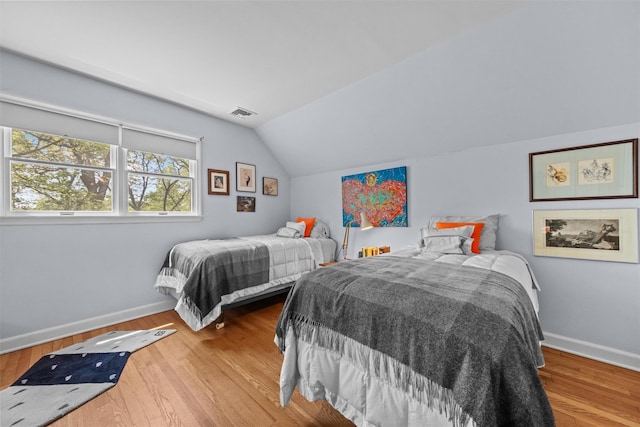 1391 Hunterbrook Rd, Yorktown Heights, NY 10598 - bedroom with baseboards, lofted ceiling, and wood finished floors