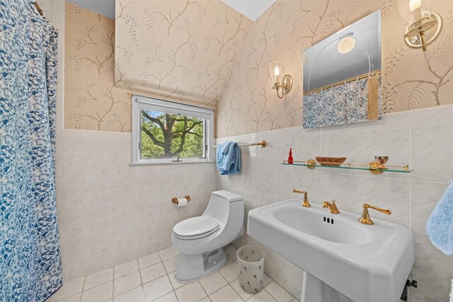 1391 Hunterbrook Rd, Yorktown Heights, NY 10598 - full bathroom with tile walls, wallpapered walls, a wainscoted wall, toilet, and a shower with curtain