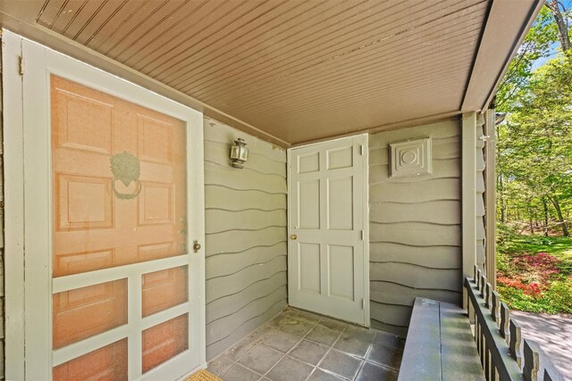 1391 Hunterbrook Rd, Yorktown Heights, NY 10598 - view of exterior entry with a porch
