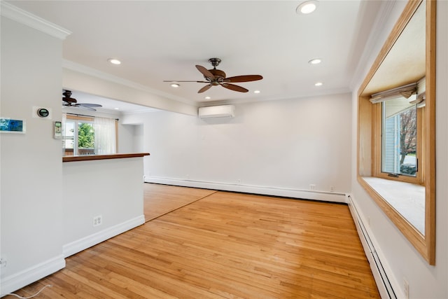empty room featuring ceiling fan, ornamental molding, light wood-style floors, and a wall unit AC