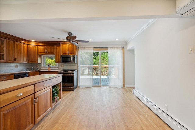 kitchen with a wall unit AC, light wood-style floors, appliances with stainless steel finishes, brown cabinets, and a baseboard radiator