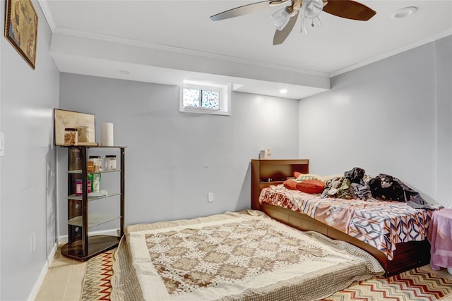 tiled bedroom with a ceiling fan and ornamental molding