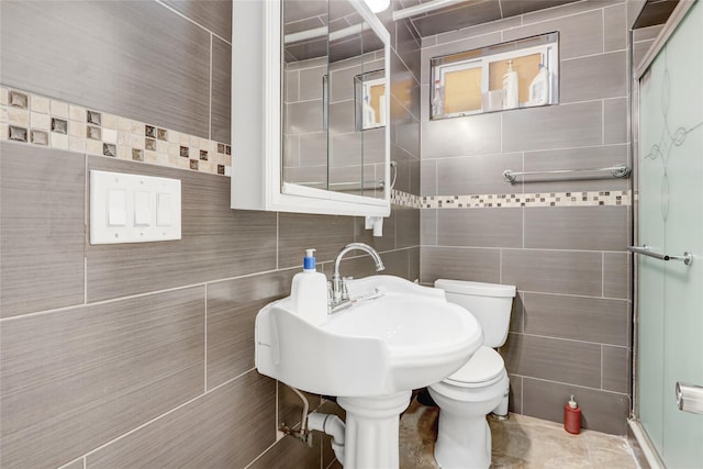 full bathroom with tile walls, toilet, decorative backsplash, and a stall shower